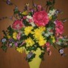 Spring floral wall bucket using artificial flowers.