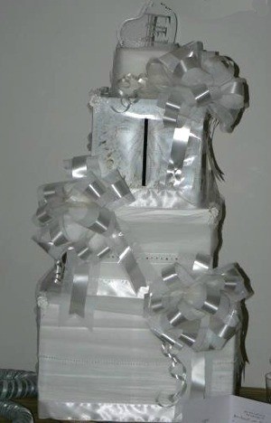 White fake cake of boxes and bows