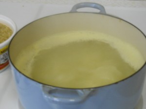 Curried chicken and rice, bringing water to boil