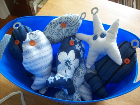 Homemade fishing game view of the finished fish and starfish in bucket.