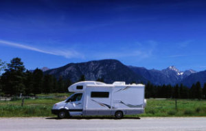 An RV out in a mountainous area.