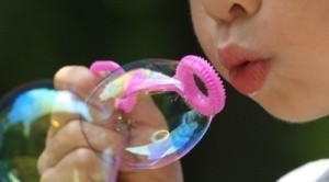 A child blowing bubbles