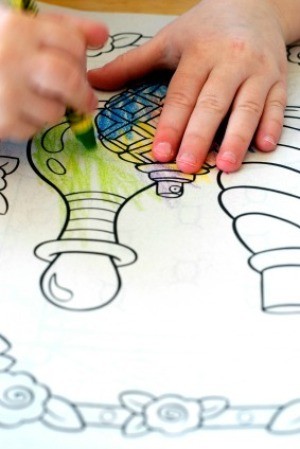 Child Coloring in a Coloring Book