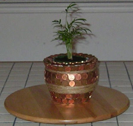 Penny covered flower pot