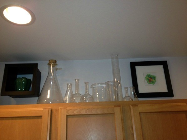Chemistry equipment on top of kitchen cabinets.
