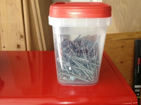 Organizing nails in recycled plastic containers.
