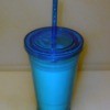 Blue Plastic Cup with lid and straw.