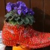 A colorfully painted boot being used as a planter.