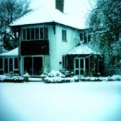 Two story house in the snow.