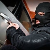 Thief Breaking into Car
