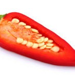 A chile pepper cut lengthwise so you can see the seeds