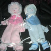 Baby blanket decorative dolls.