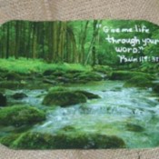 Mouse pad with woodland stream photo.