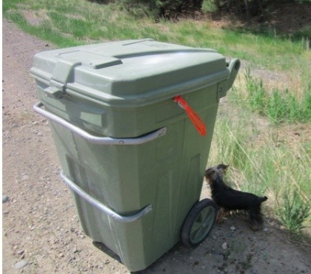 Trash can with pull tie showing.