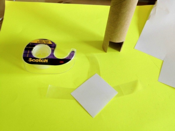 Paper square and tape.