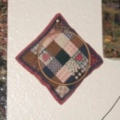 Printed quilt block in embroidery hoop.