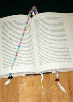 A beaded bookmark in a book.