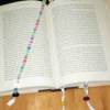 A beaded bookmark in a book.