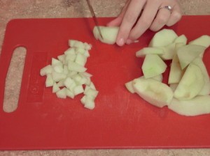 Chopping apples for egg rolls.