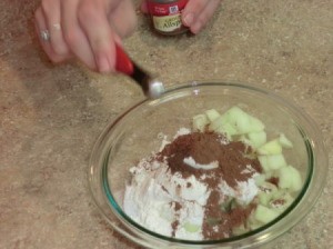 Adding ingredients to bowl.