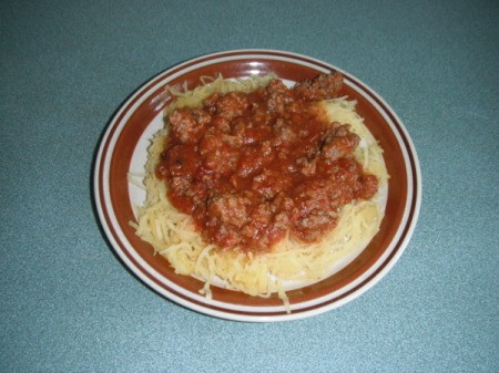 Plate of Spaghetti Squash with spaghetti sauce.