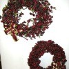 Two red berry wreaths.