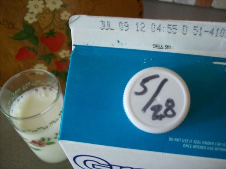Write date that milk is opened on cap.