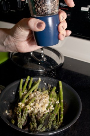 Sauteed Lemon Ginger Asparagus being peppered