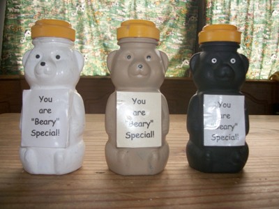 Honey bear containers painted in three colors for gifts.