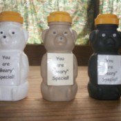 Honey bear containers painted in three colors for gifts.