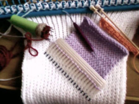 A comb being used as a pocket knitter