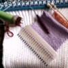A comb being used as a pocket knitter