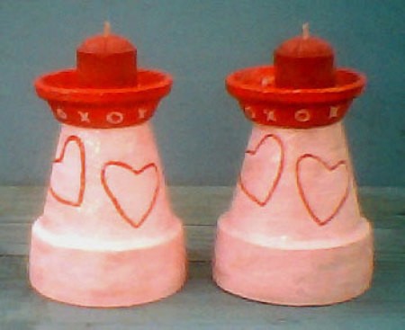 Decorated clay pot candleholders.