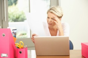 A woman paying her bills online.