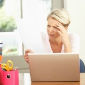 A woman paying her bills online.