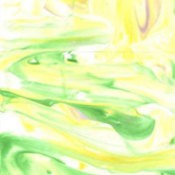 Closeup of green and yellow tie dye paper.
