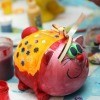 A photo of a piggy bank painted by a child.