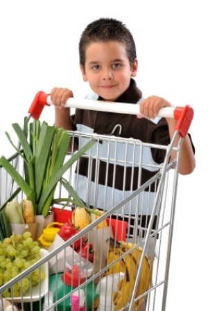 Young Boy Pushing Shopping Cart