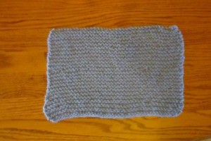 Knitted rectangular cozy.