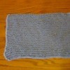 Knitted rectangular cozy.