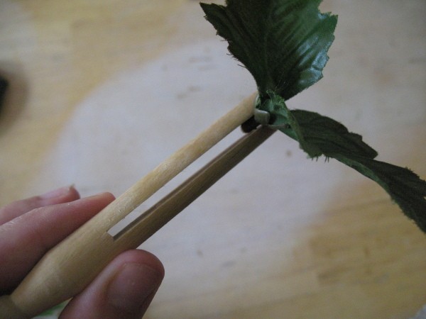 Sliding leaves up the inside of clothes pin.