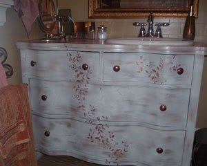 Refurbished dresser as bathroom vanity.