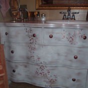 Refurbished dresser as bathroom vanity.