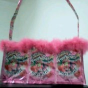 Pink purse made from pouches and pink trim.