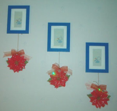 CDa with poinsettias attached as wall hangings.