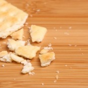 Cracker Crumbs on Wooden Cutting Board