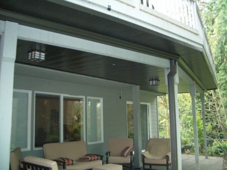 View of upper deck and patio below.