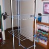 A laundry drying rack in a spare bedroom
