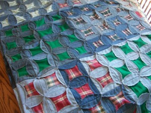 Denim and plaid flannel quilt.