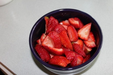 Quartered strawberries in bowl